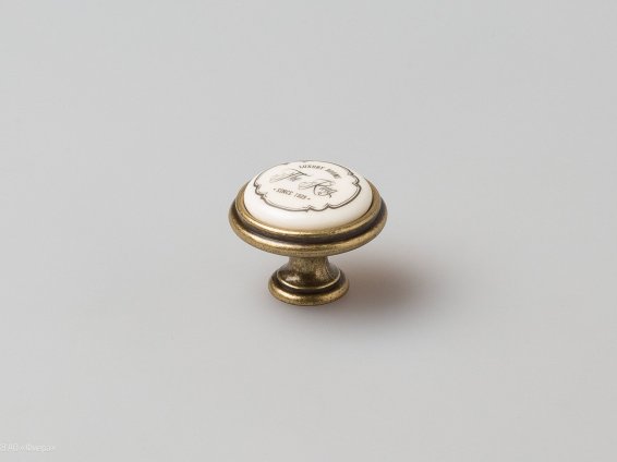 P77 мебельная ручка-кнопка античная бронза с керамической вставкой цвета слоновой кости и надписью The Ring